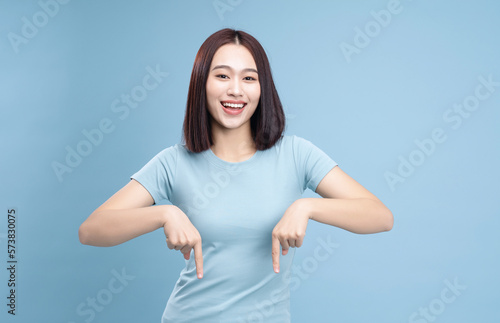 Image of young Asian woman posing on background © Timeimage