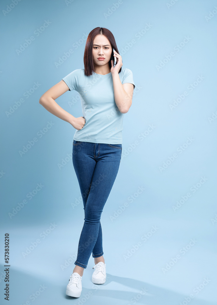 Image of young Asian woman posing on background Image of young Asian woman posing on background