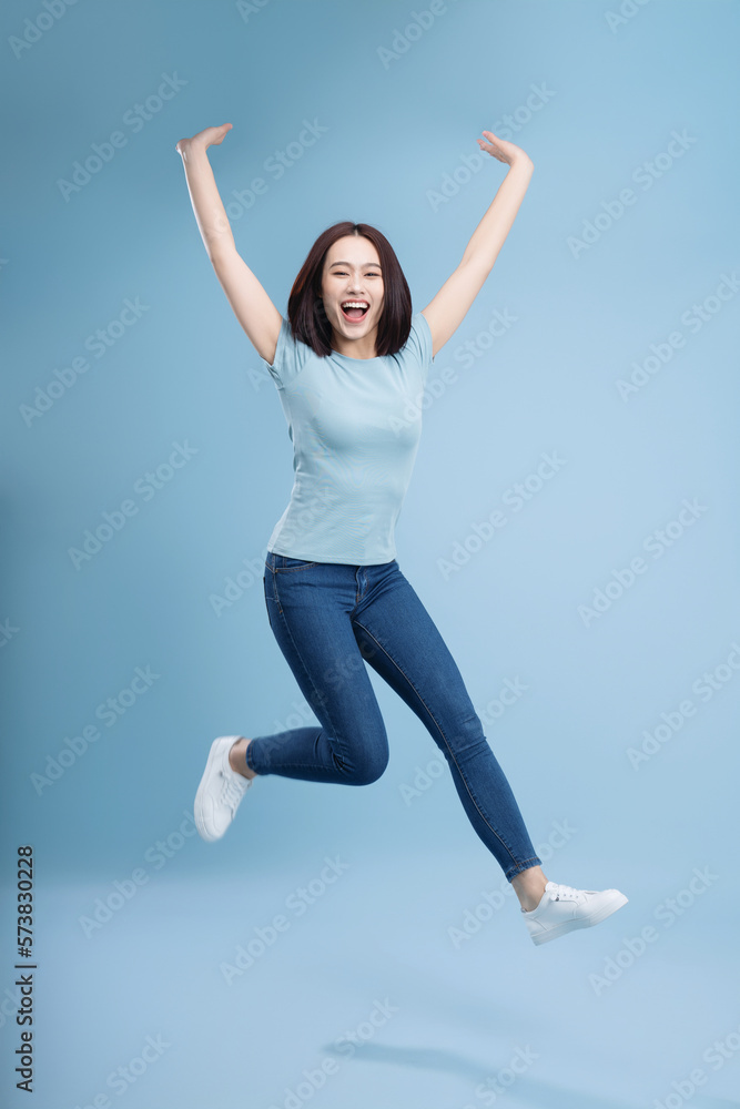 Image of young Asian woman posing on background