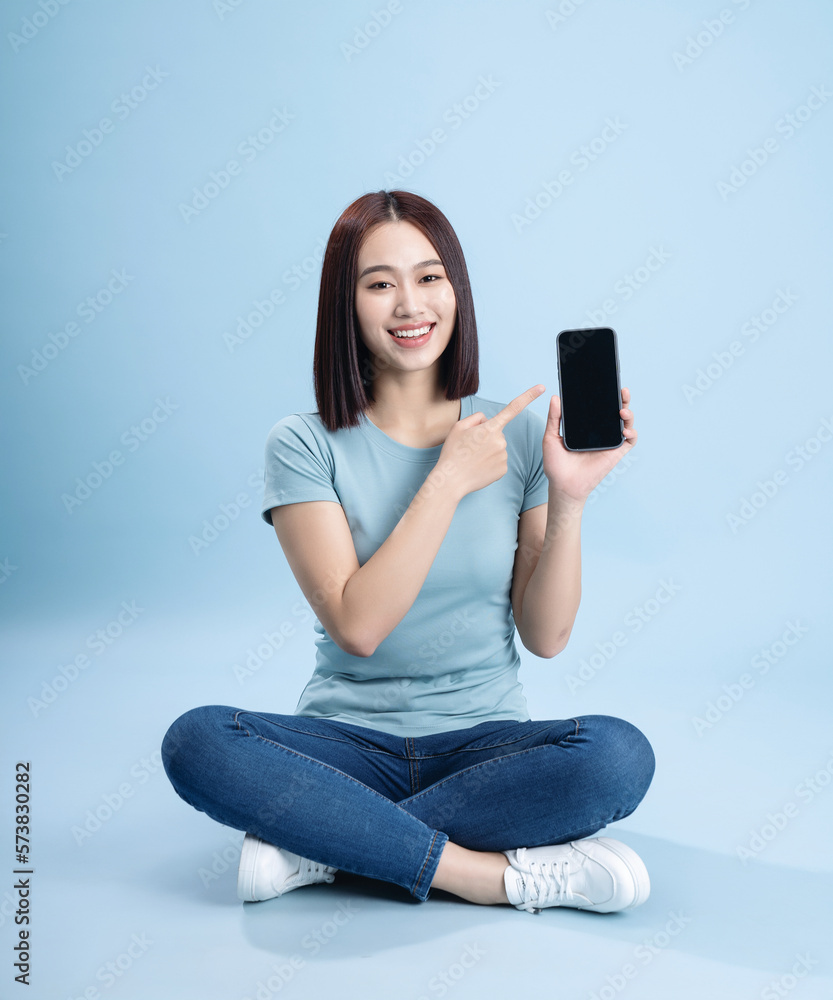 Image of young Asian woman posing on background Image of young Asian woman posing on background