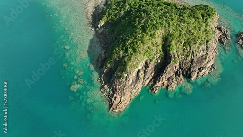 tropical island surrounded by coral reef in queensland australia photo