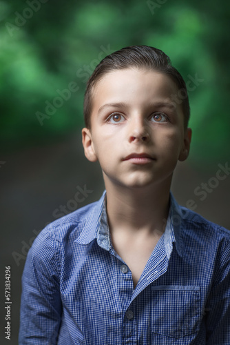 child standing outside and posing, a portrait of a boy