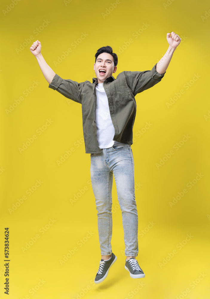 Full length image of young Asian business man standing on background Full length image of young Asian business man standing on background