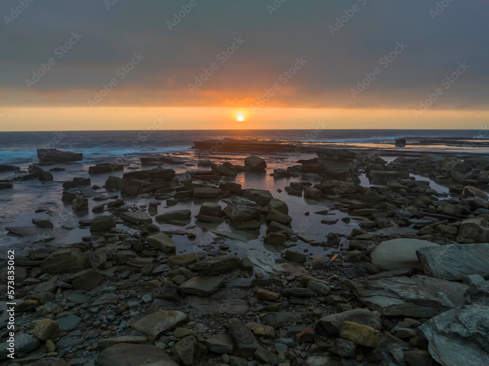 Hazy Summer Sunrise Seascape and Rocky Inlet Hazy Summer Sunrise Seascape and Rocky Inlet