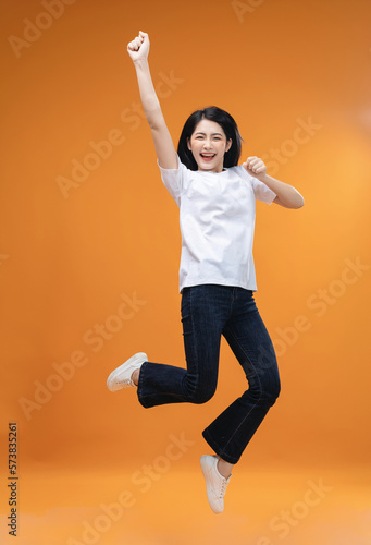 Full length image of young Asian girl on background © Timeimage