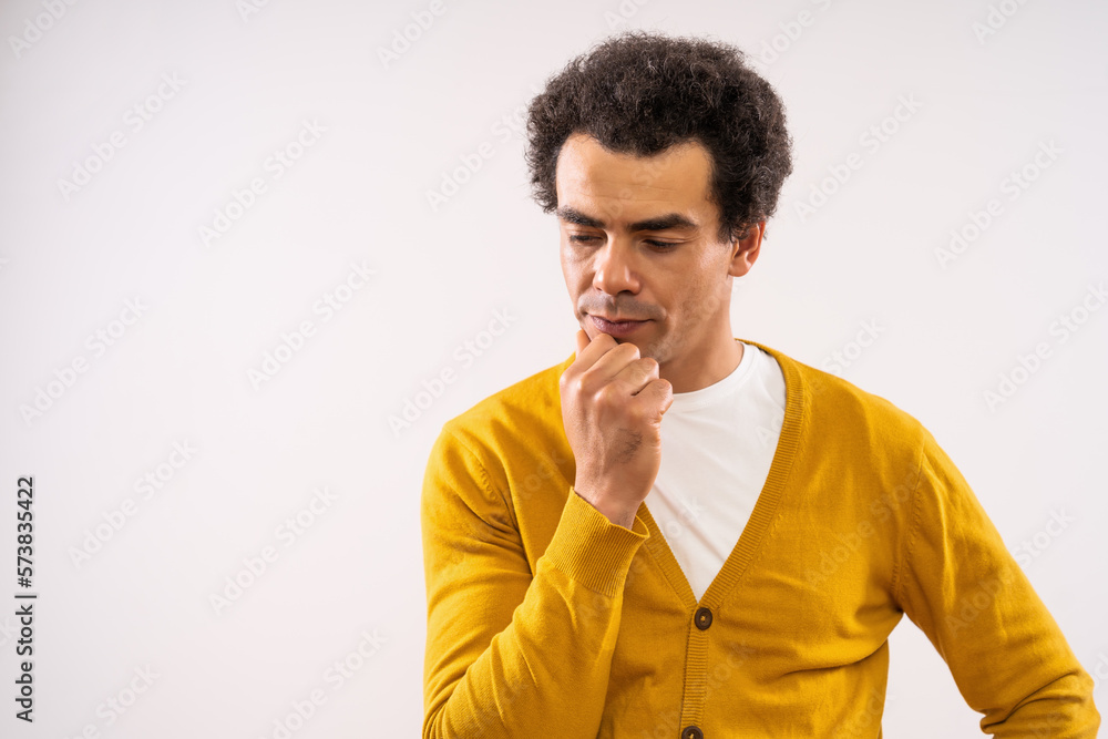 Studio shot portrait of pensive and worried multiracial man. Studio shot portrait of pensive and worried multiracial man.