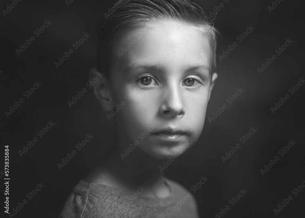 child standing outside and posing, a portrait of a boy