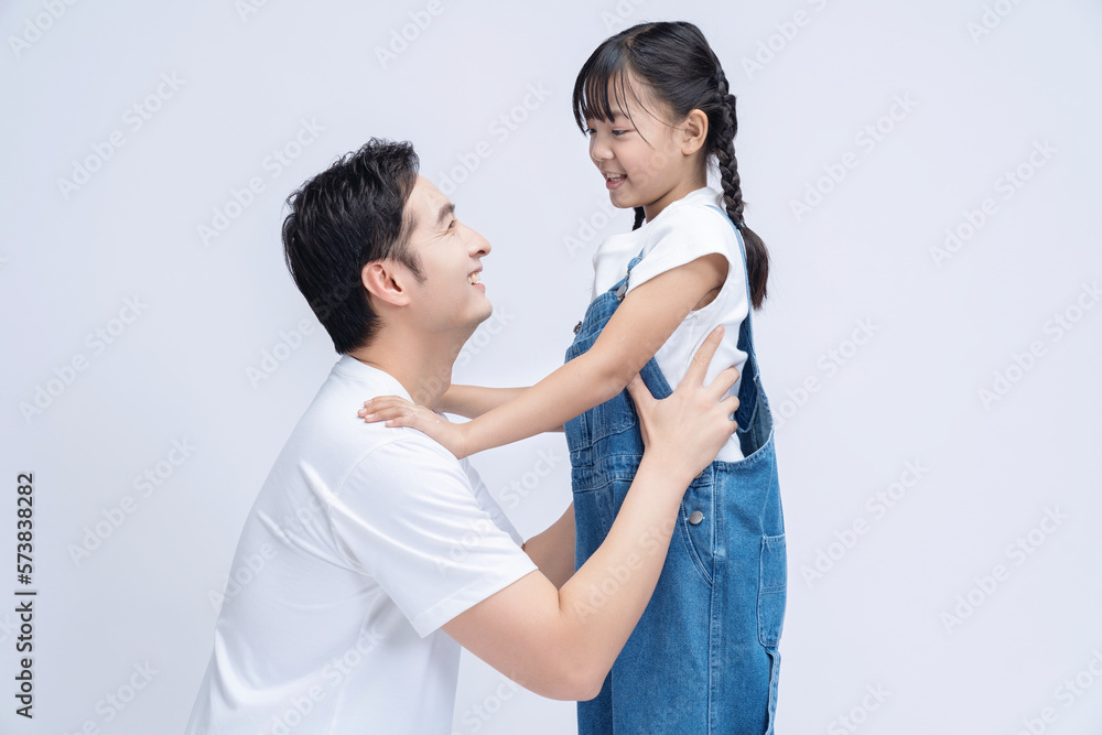 Image of Asian father and daughter on background Image of Asian father and daughter on background