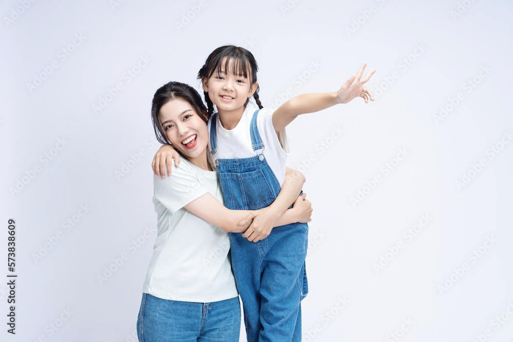 Image of Asian mother and daughter on background Image of Asian mother and daughter on background