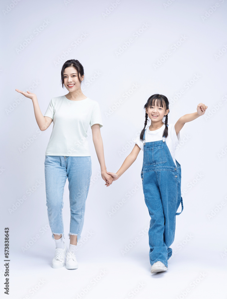 Image of Asian mother and daughter on background Image of Asian mother and daughter on background