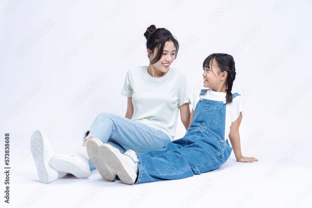 Image of Asian mother and daughter on background Image of Asian mother and daughter on background