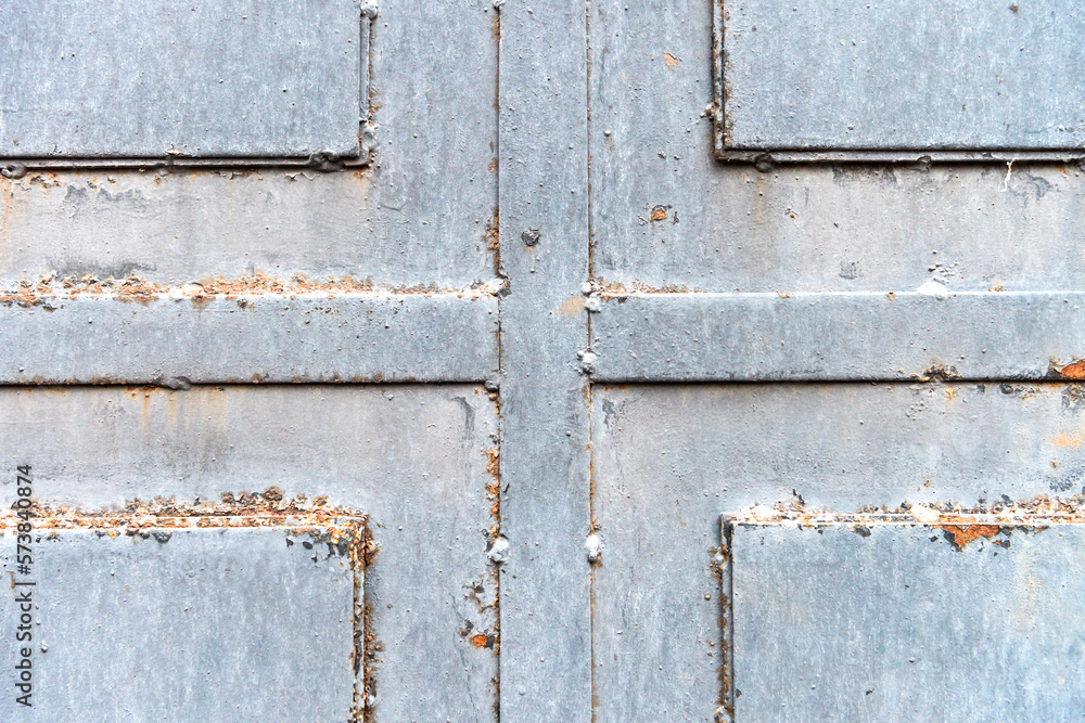 sheet metal texture. welded metal door made of several sheets of iron. iron door texture closeup sheet metal texture. welded metal door made of several sheets of iron. iron door texture closeup