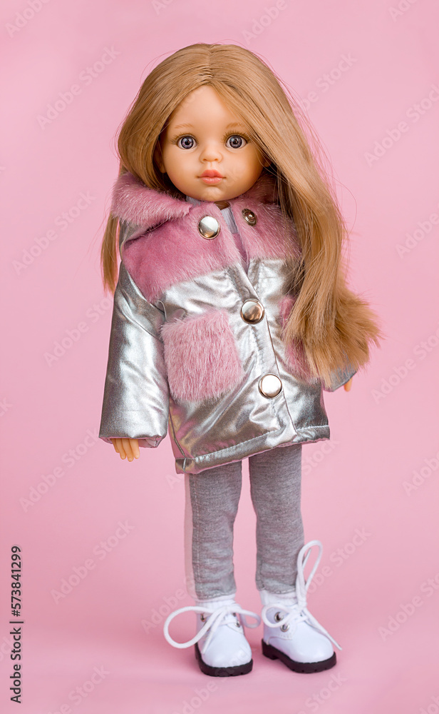  Beautiful vinyl doll in fashionable and stylish clothes, modern dolls for modern children, selective focus