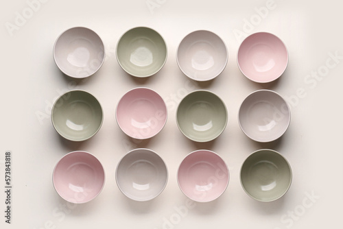 Twelve pastel ceramic bowls...