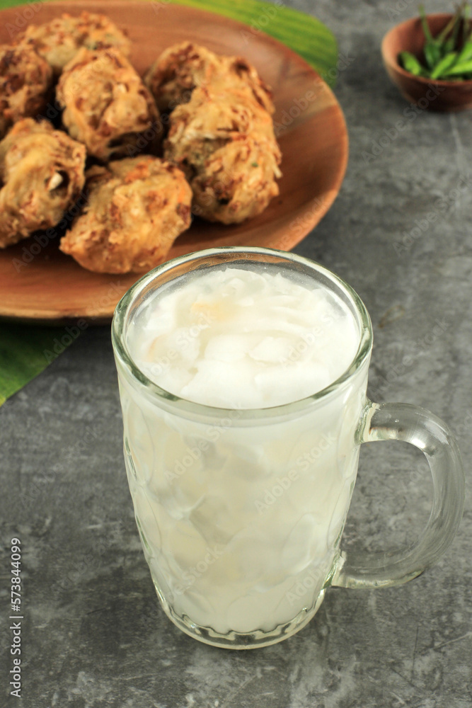 Es Kelapa Muda or Young Coconut Drink with Bala-Bala Vegetable Fritter. Es Kelapa Muda or Young Coconut Drink with Bala-Bala Vegetable Fritter.
