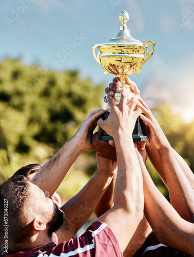 Fototapeta Naklejka Na Ścianę i Meble -  Rugby, champion or hands of team with trophy for achievement, goals or group success together. Celebration, gold winner or happy people with cups awards for winning a sports competition or tournament