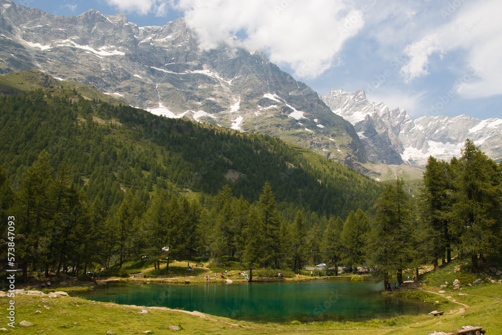 Panoramic view of idyllic alpine lake with emerald water in Aosta Valley, Italy