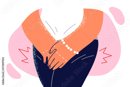 Woman presses hands to groin, having experienced sharp desire to visit toilet due to enuresis