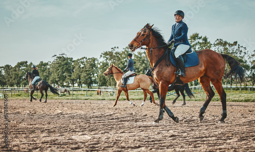 Woman, horse and race with ride, space and mockup with portrait, smile and outdoor sports in nature. Equestrian, riding and smile for sport with helmet, safety and happiness for fitness with mock up © Kirsten D/peopleimages.com