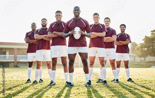 Rugby, grass and portrait of team with smile standing together in confidence and solidarity for winning game. Diversity, black man and group of strong sports men with leadership, fitness and teamwork