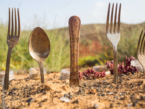 old rusty cutlery in the red sand