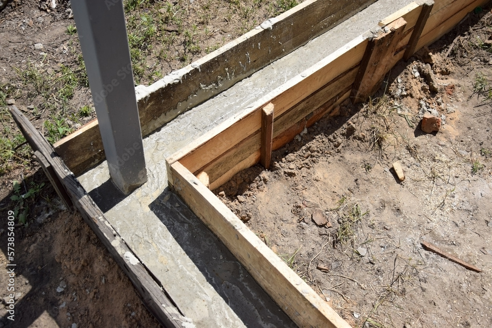 Wooden formwork concrete strip foundation for a veranda in a house. Wooden formwork concrete strip foundation for a veranda in a house.