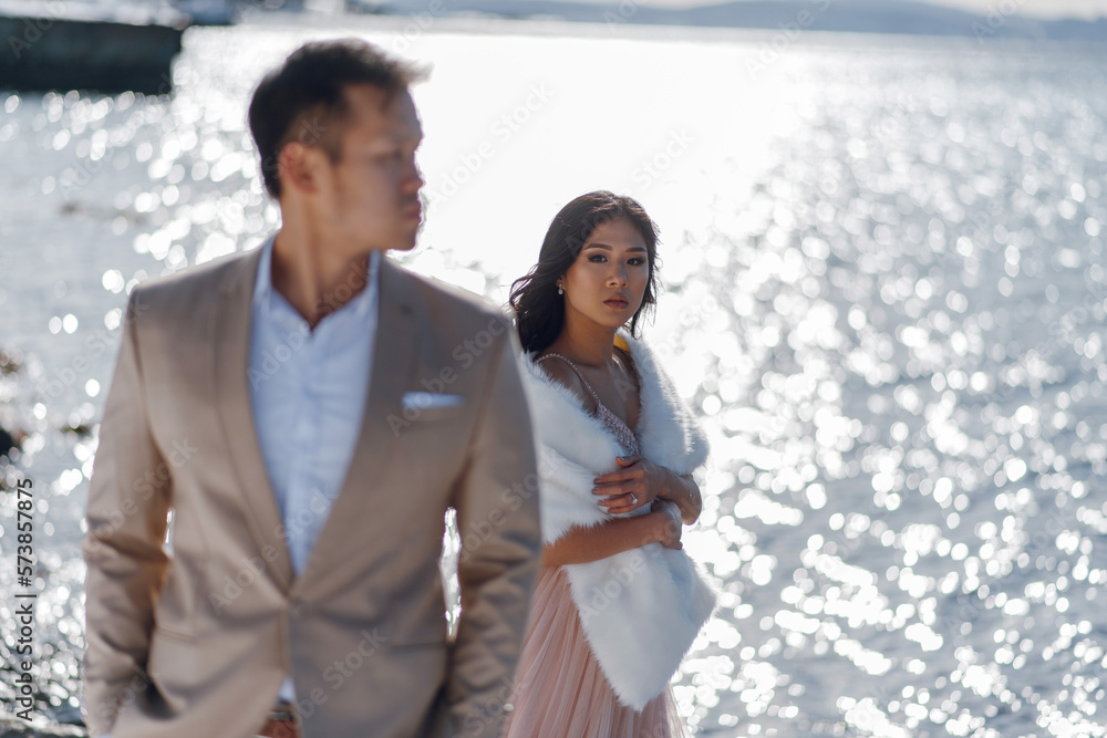 Beautiful wedding couple posing near water view