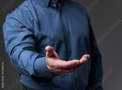 Hand of a businessman offering or requesting