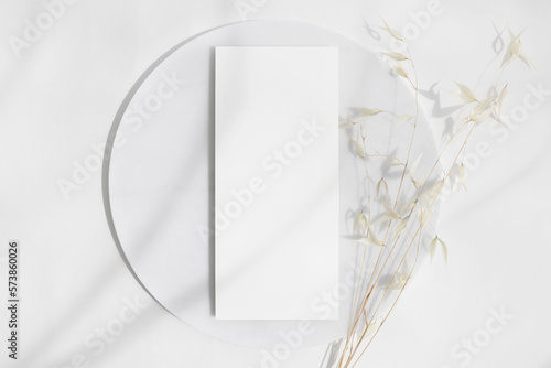 4x9 menu card mockup on round white board photo