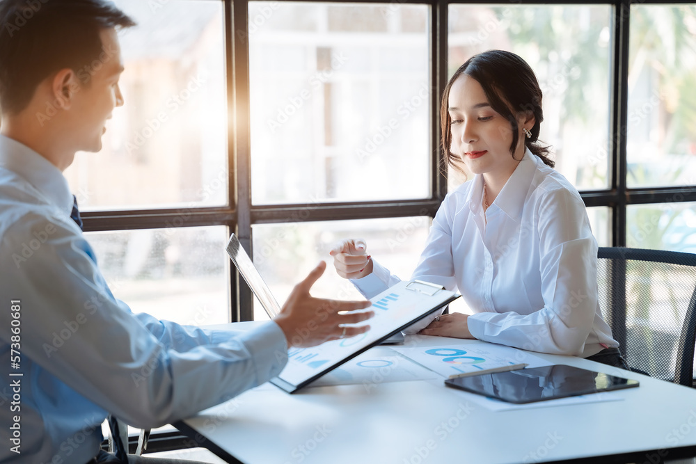 Young Asian business team creative businesspeople coworker in office. Meeting Presentation for analysis graph company financial. People Work in Business Office.