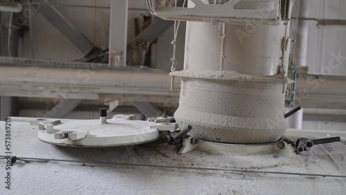 The grain is loaded into a tank truck. Loads dry cargo ship with grain. The grain is automatically loaded into the vehicle.