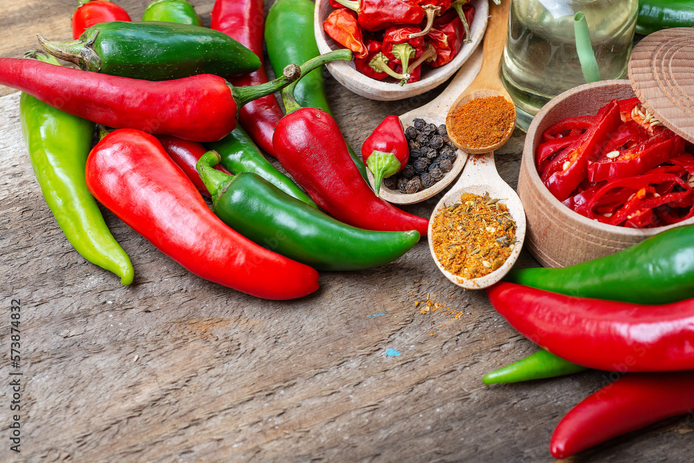 different seasonings for cooking, varieties of hot chilli pepper, ground pepper and spices, oil. for the text recipe different seasonings for cooking, varieties of hot chilli pepper, ground pepper and spices, oil. for the text recipe