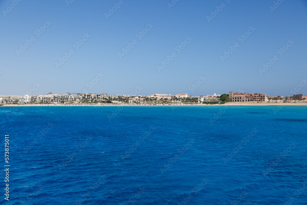  Hurghada, Egypt. . Buildings, swimming pools and a recreation area by the red sea.