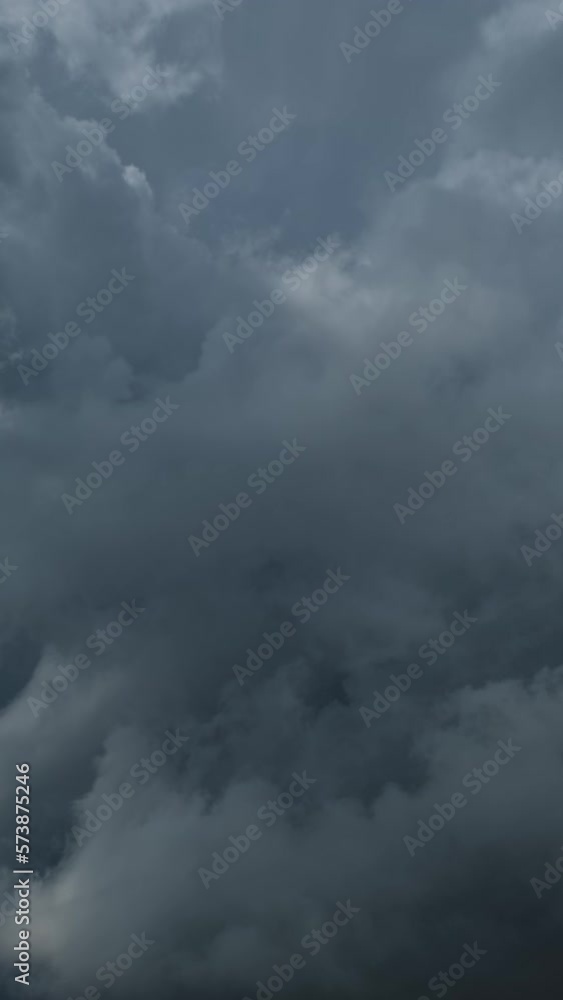 Dramatic dark storm clouds are moving fast. Vertical video Dramatic dark storm clouds are moving fast. Vertical video