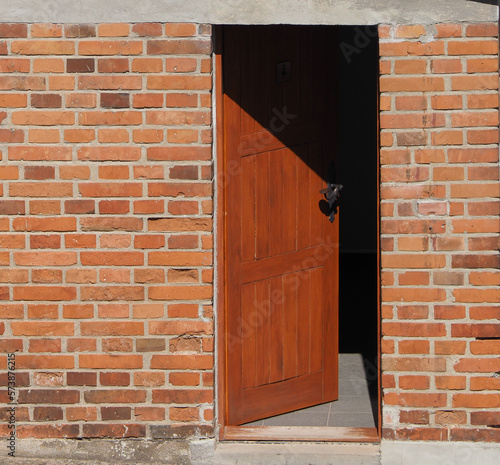 open door in brick wall