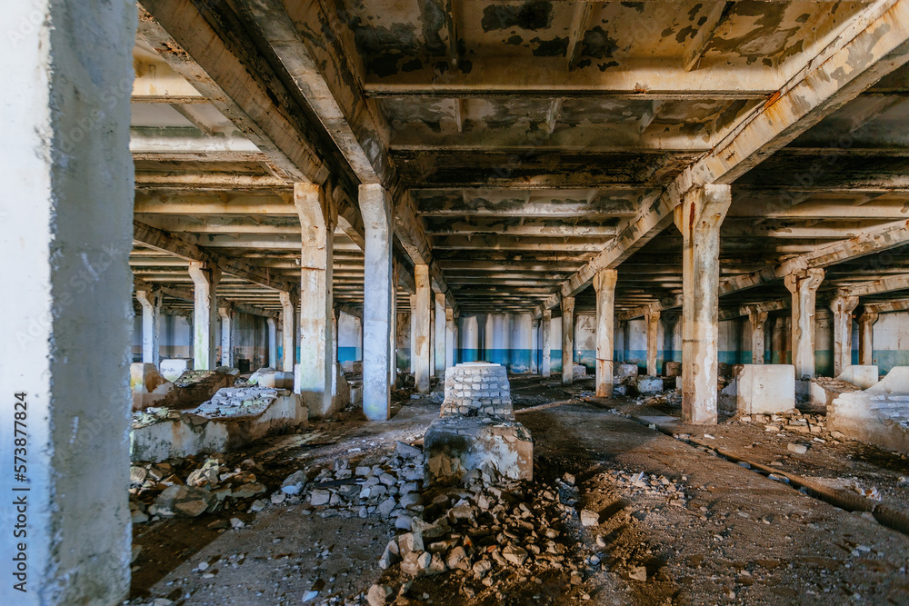 Abandoned factory. Large empty ruined industrial hall Abandoned factory. Large empty ruined industrial hall