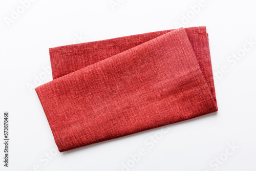 Foto top view with red empty kitchen napkin isolated on table background