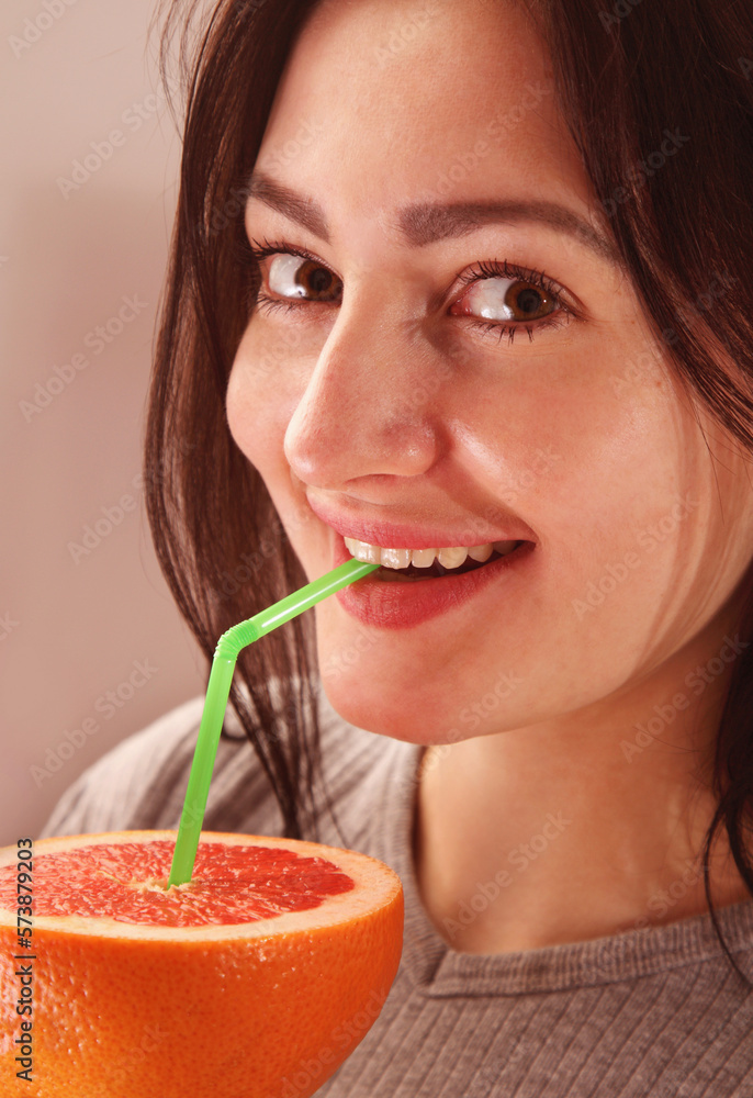 Attractive pretty woman with healthy vitamin orange fruit drink.  Healthy food, fresh, juice, delicious concept.