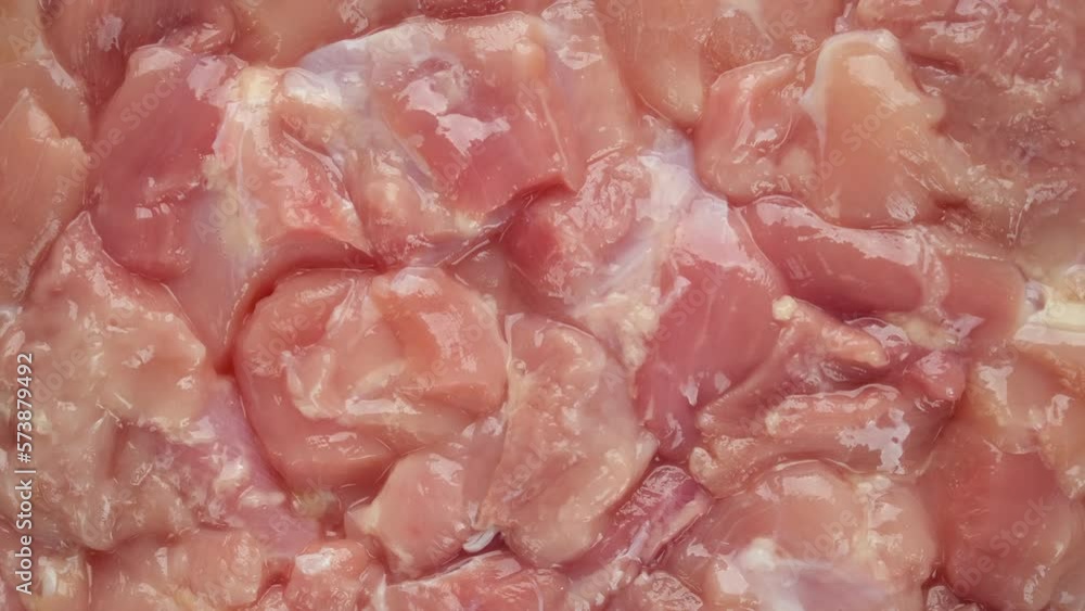 Chopped raw chicken meat top view, rotation Chopped raw chicken meat top view, rotation