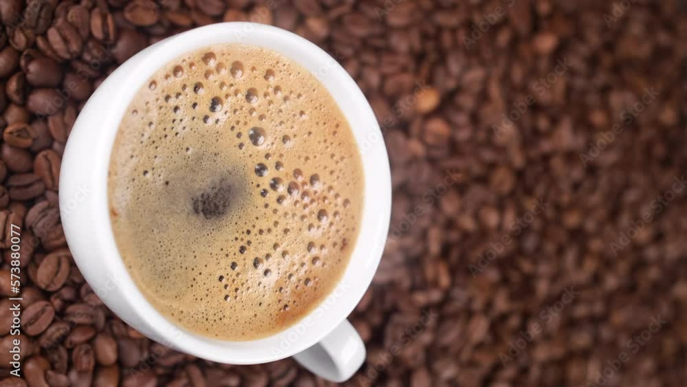 Cup of hot black coffee with froth. Coffee with froth. Vertical video Cup of hot black coffee with froth. Coffee with froth. Vertical video