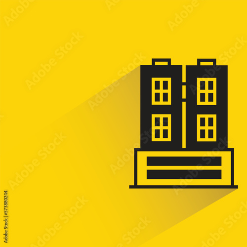 city building with shadow on yellow background