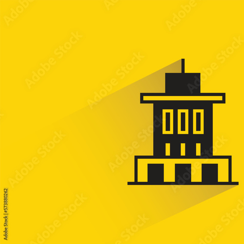 city building with shadow on yellow background