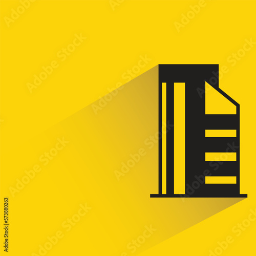 city building with shadow on yellow background