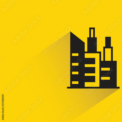 city building with shadow on yellow background