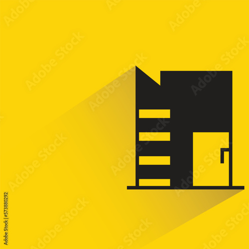 city building with shadow on yellow background