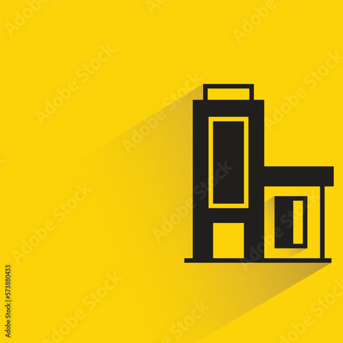 office building with shadow on yellow background