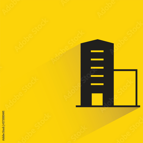 office building with shadow on yellow background