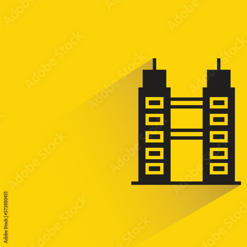 office building with shadow on yellow background
