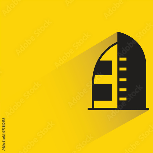 office building with shadow on yellow background