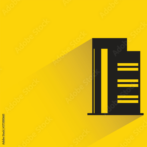 office building with shadow on yellow background